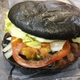 Illustration for article titled Burger King's all-black burger looks absolutely disgusting in real life